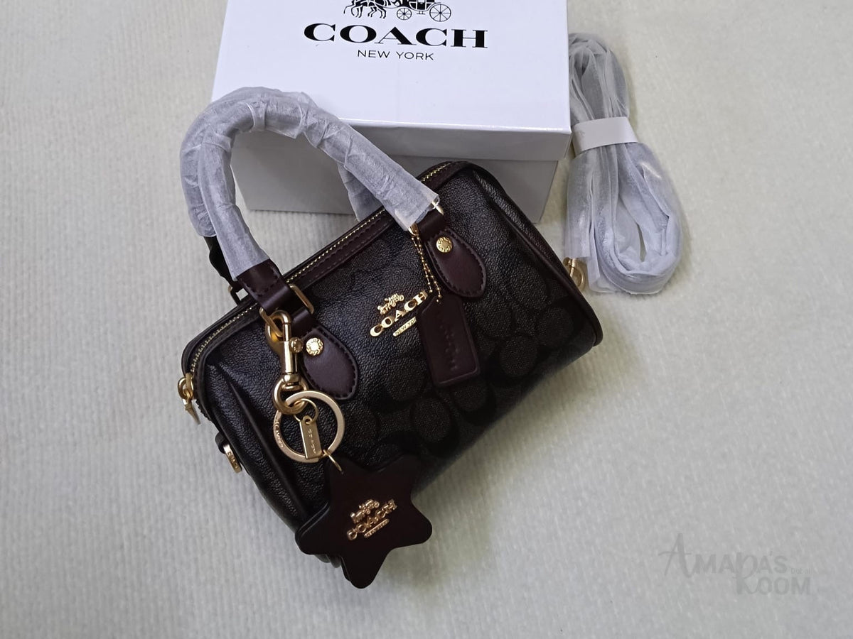 Coach Bag | Mini Rowan Crossbody Bag (featuring a detachable star logo charm) – Brown – Black (Signature Canvas with dark brown leather trim and gold-tone hardware)